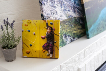 exhibition of photos, photocanvases, active little girl.