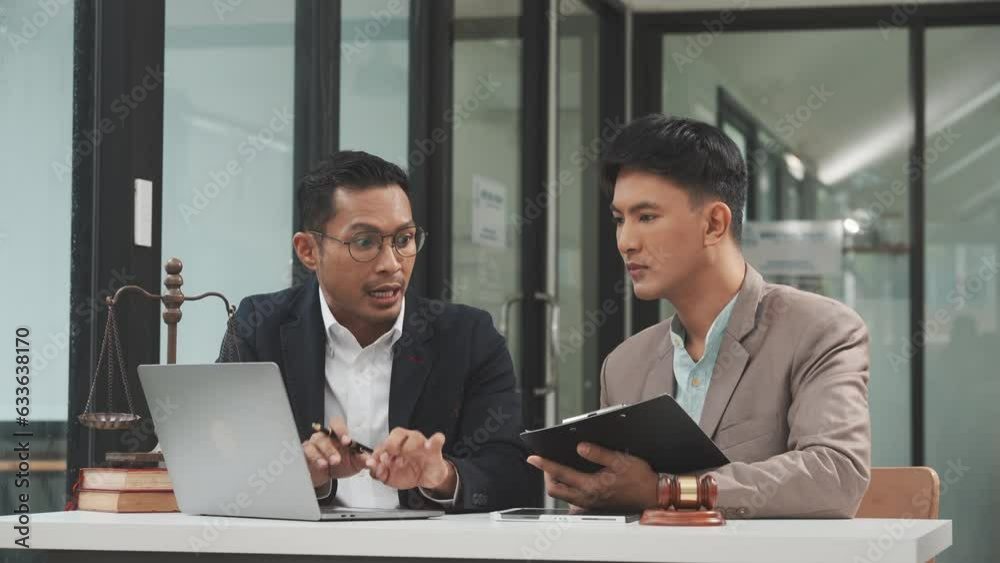 Two disgusting businessmen Asian lawyer of Indian descent paying attention to mistakes, proposing corrections. Businessman discussing contract policy terms with client, rights of liberty concept. Two disgusting businessmen Asian lawyer of Indian descent paying attention to mistakes, proposing corrections. Businessman discussing contract policy terms with client, rights of liberty concept.