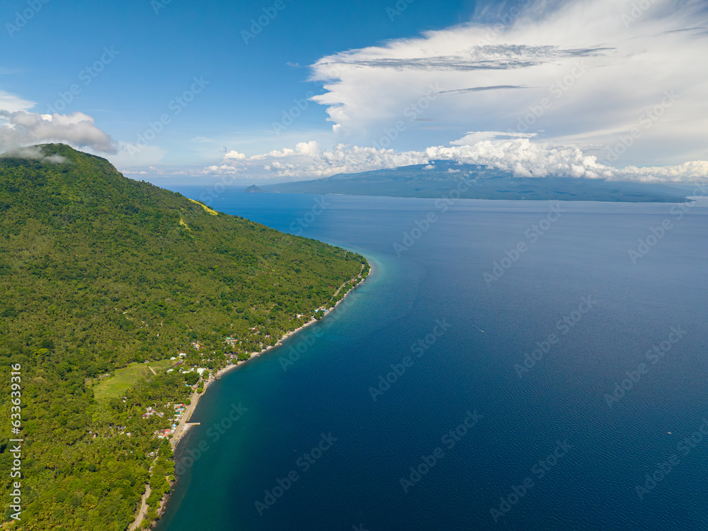 Tropical Island with blue sea. Blue sky and clouds. Camiguin, Philippines.