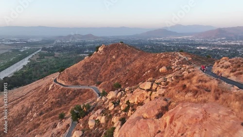 mt rubidoux in riverside california at sunset with people hiking in view photo