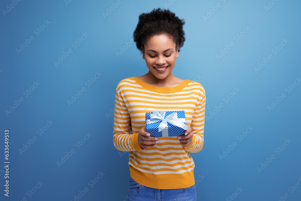 joyful afro brunette 20s latin young woman received a birthday present joyful afro brunette 20s latin young woman received a birthday present
