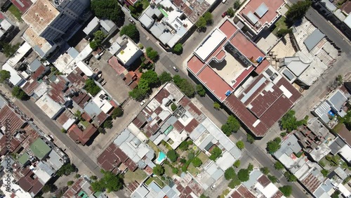 Top down drone shots flying over the gridded city of Gualeguaychú, Entre Ríos, Argentina on a sunyy day. photo