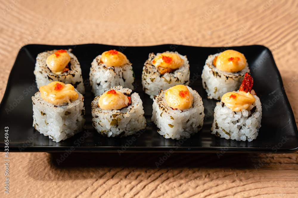 sushi is a Japanese dish of prepared vinegared rice, usually with some sugar and salt, accompanied by a variety of ingredients such as seafood, often raw and vegetables. sushi is a Japanese dish of prepared vinegared rice, usually with some sugar and salt, accompanied by a variety of ingredients such as seafood, often raw and vegetables.