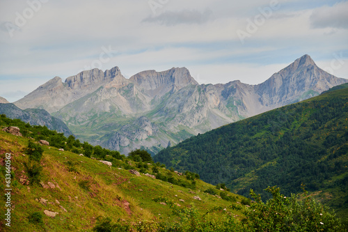 Wallpaper Mural Mountain ridge with green forest under cloudy sky Torontodigital.ca