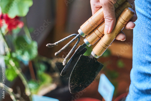 Crop person with gardening tools outdoors photo