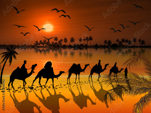 Camels caravan on a beautiful sunset background