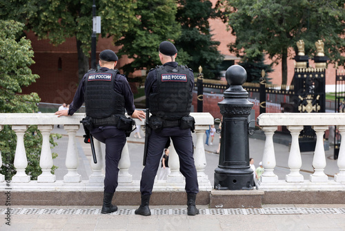 Photography Russian police officers patrol a city street in Moscow on Kremlin background