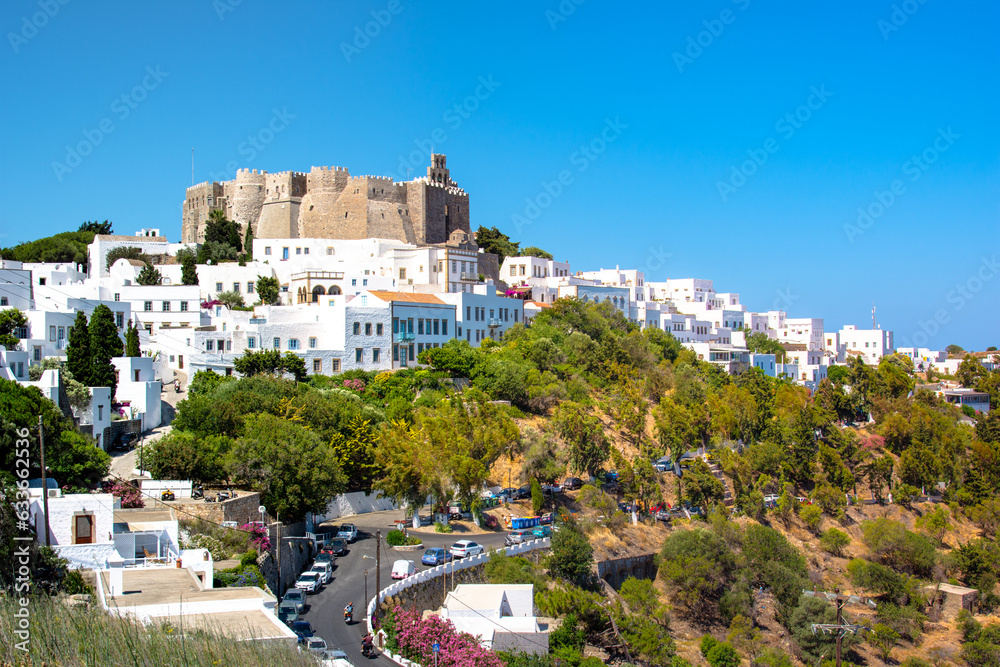 The three windmills of Chora and iconic Monastery of Saint John the Theologian in chora of Patmos island, Dodecanese, Greece
