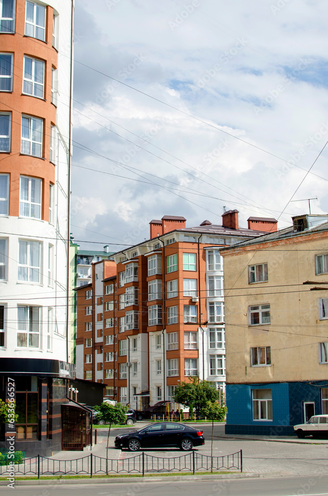 Fototapeta premium The car is parked near an apartment building