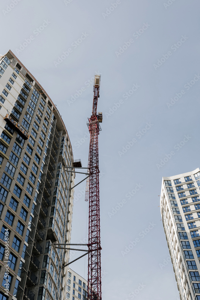 Fototapeta premium Construction crane and the building