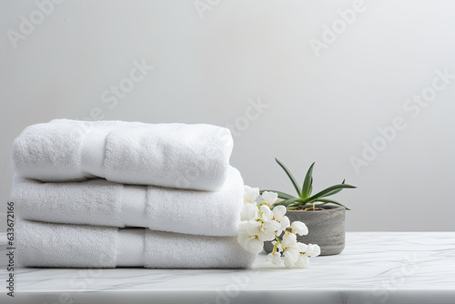 White surface with spa towels on it