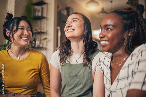 Happy, friends and women in a living room with funny, conversation and bond in their home together. Gossip, smile and people with diversity in a house for reunion, weekend and relax on day off