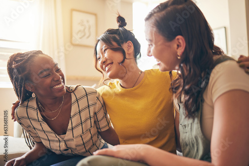 Happy, hug and women friends gossip, speaking and bond with care, trust and story in their home. Smile, embrace and people with diversity in a living room with support, conversation and social visit