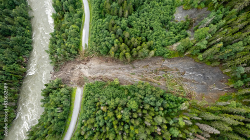 Aerial shot of big river and landslides during flood
