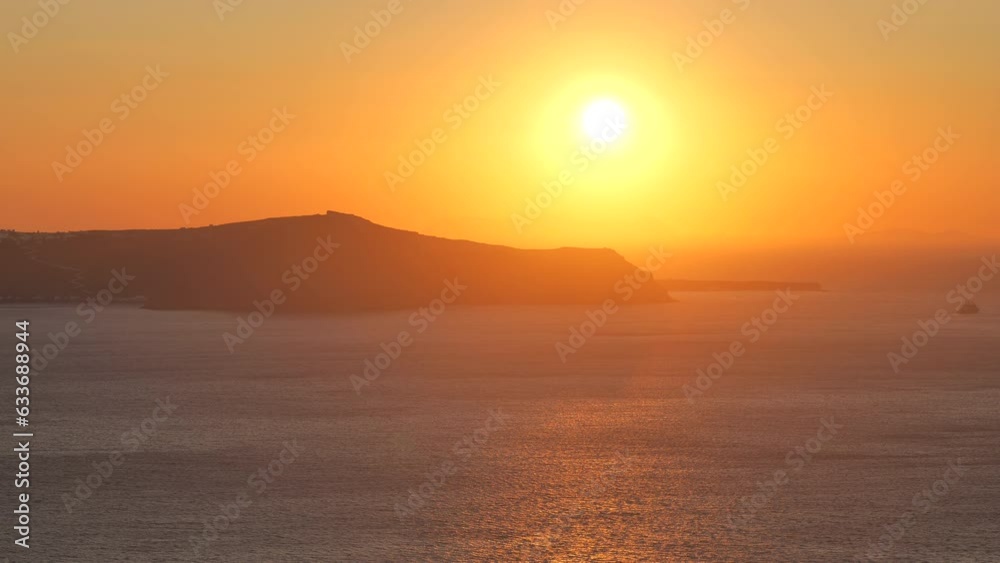 Santorini Sunset Above the Caldera Seen from Fira in Summer Santorini Sunset Above the Caldera Seen from Fira in Summer