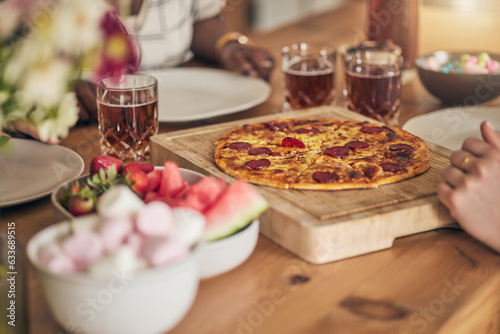 Food, drink and pizza, people have lunch and wooden table with snacks and nutrition, eating and wellness. Italian cuisine, fruit and sweets with social gathering, meal together and hungry with party