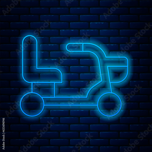 Glowing neon line Electric wheelchair for disabled people icon isolated on brick wall background. Mobility scooter icon. Vector