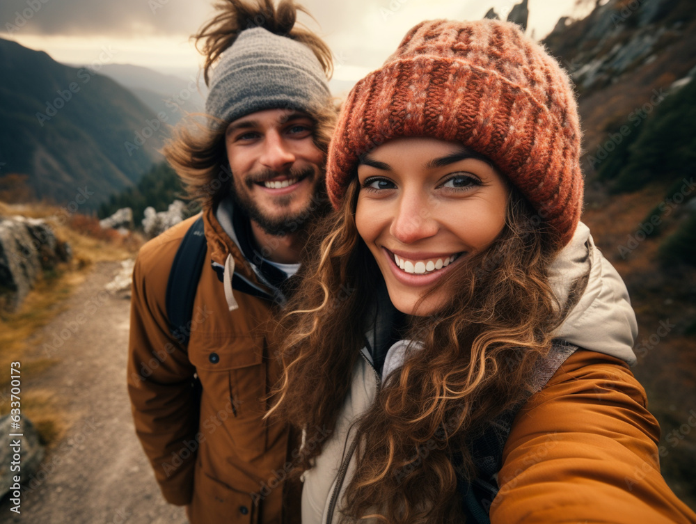 Young attractive couple smiling happy travel and selfie photo on on the mountains, romantic couple traveler, boho hipster style outfit Young attractive couple smiling happy travel and selfie photo on on the mountains, romantic couple traveler, boho hipster style outfit