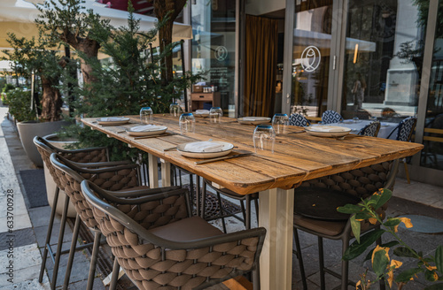 Opened restaurant table with chairs in the city