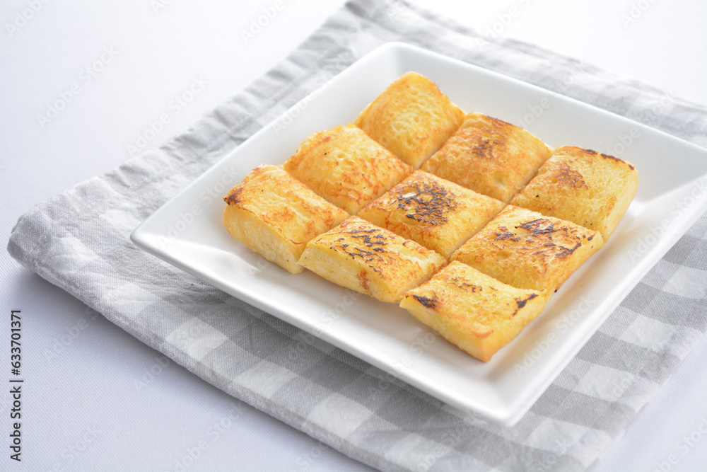 square fried egg French toast bread set with half boiled soft chicken egg and hot coffee or tea breakfast on white background asian chef appetiser halal bakery food restaurant pastry menu for cafe square fried egg French toast bread set with half boiled soft chicken egg and hot coffee or tea breakfast on white background asian chef appetiser halal bakery food restaurant pastry menu for cafe