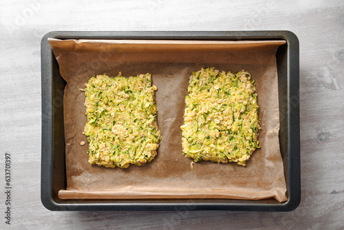 Obraz na plátně Dough of zucchini and oat flakes as a base for vegan low carb pizza or vegetable
