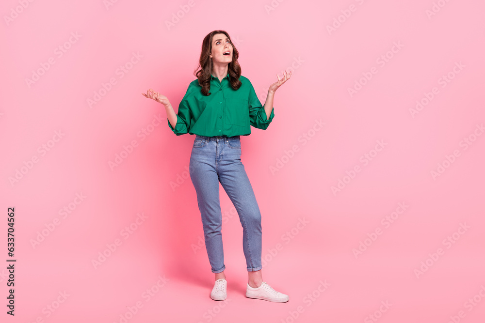 Full size photo of negative unsatisfied girl raise hands look up empty space asking why isolated on pink color background