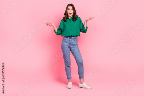 Full length portrait of impressed speechless questioned person raise arms disbelief isolated on pink color background