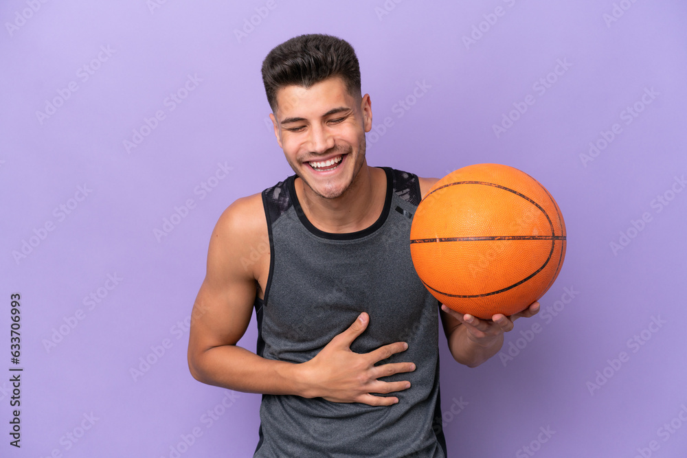 young caucasian woman  basketball player man isolated on purple background smiling a lot
