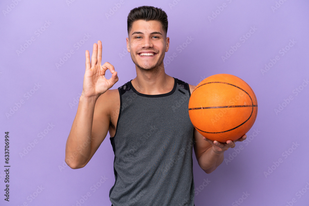 young caucasian woman  basketball player man isolated on purple background showing ok sign with fingers