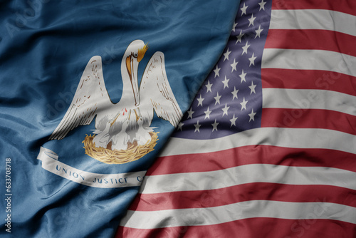 Fotografía big waving colorful national flag of united states of america and flag of louisiana state