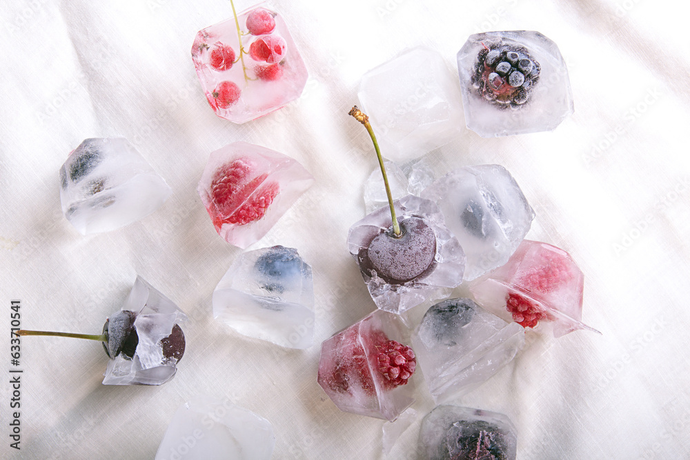 Frozen raspberries, blackberries, blueberries, blueberries, cherries, black currants in ice cubes Frozen raspberries, blackberries, blueberries, blueberries, cherries, black currants in ice cubes