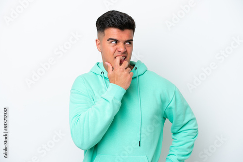 Young caucasian handsome man isolated on white background nervous and scared © luismolinero