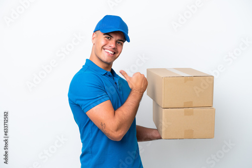 Delivery caucasian man isolated on white background proud and self-satisfied © luismolinero