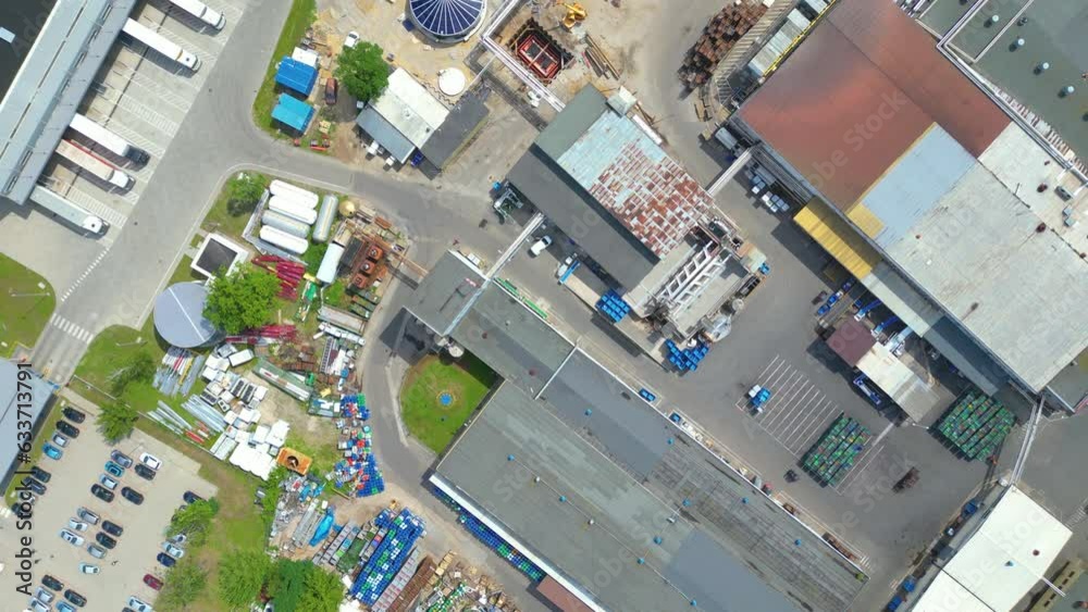 Aerial view of goods warehouse. Logistics center in industrial city zone from above. Aerial view of trucks loading at logistic center Aerial view of goods warehouse. Logistics center in industrial city zone from above. Aerial view of trucks loading at logistic center