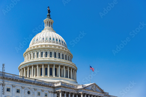 The United States Capitol building with American flag, Washington DC, USA. photo
