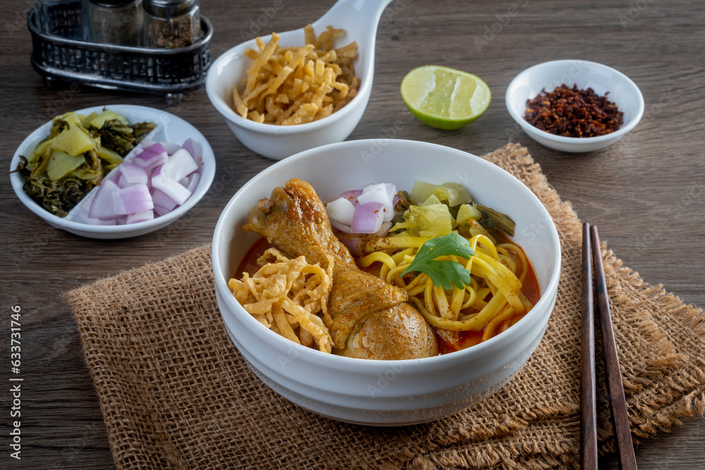 Khao Soi Kai, Thai Noodles Khao Soi Chicken with seasoning served on table Khao Soi Kai, Thai Noodles Khao Soi Chicken with seasoning served on table