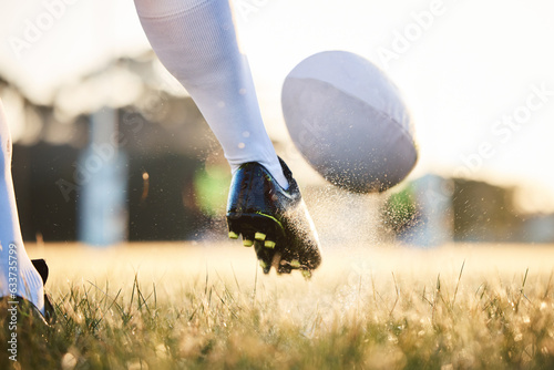 Rugby ball, feet kick and sport game with support, exercise and competition with athlete training. Field and target practice on grass with cardio, fitness and workout with shoe and boot closeup