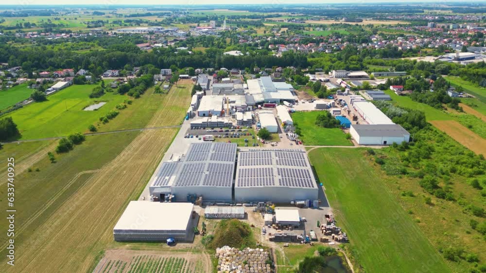 Industry with low carbon footprint. Industrial warehouses with solar panels on the roof. Technology park and factories from above. Industry with low carbon footprint. Industrial warehouses with solar panels on the roof. Technology park and factories from above.