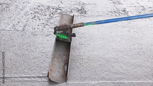 In addition to leveling concrete for driveways, workers use trowel level