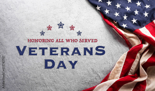 Happy Veterans day concept made from American flag and the text on dark stone background.