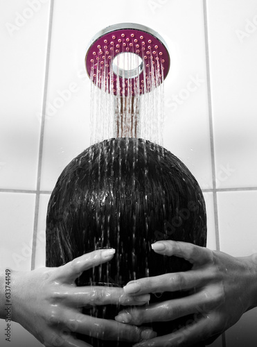 Woman bathing and washing her hair