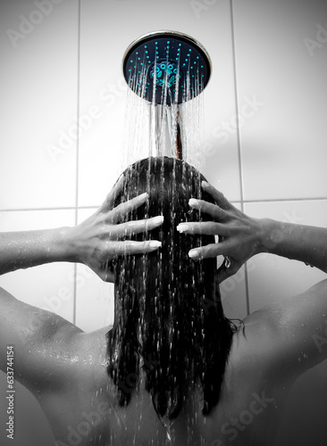 Woman bathing and washing her hair