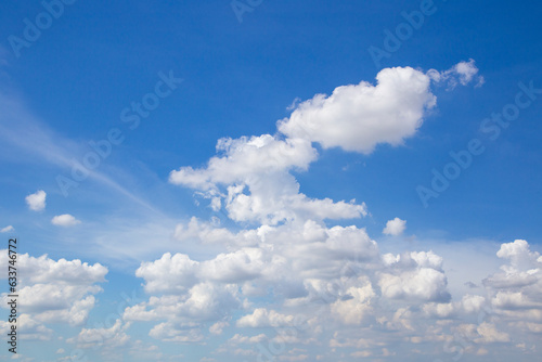 The beautiful blue sky and white fluffy cloud horizon outdoor for background.