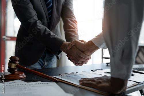 Fotografie The handshake after a good cooperation, consulting between attorney and client, businessman, tax and real estate project company