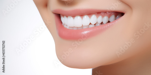 Close-up of woman's smile with white bleached teeth isolated on flat light background with copy space. Professional teeth whitening. 