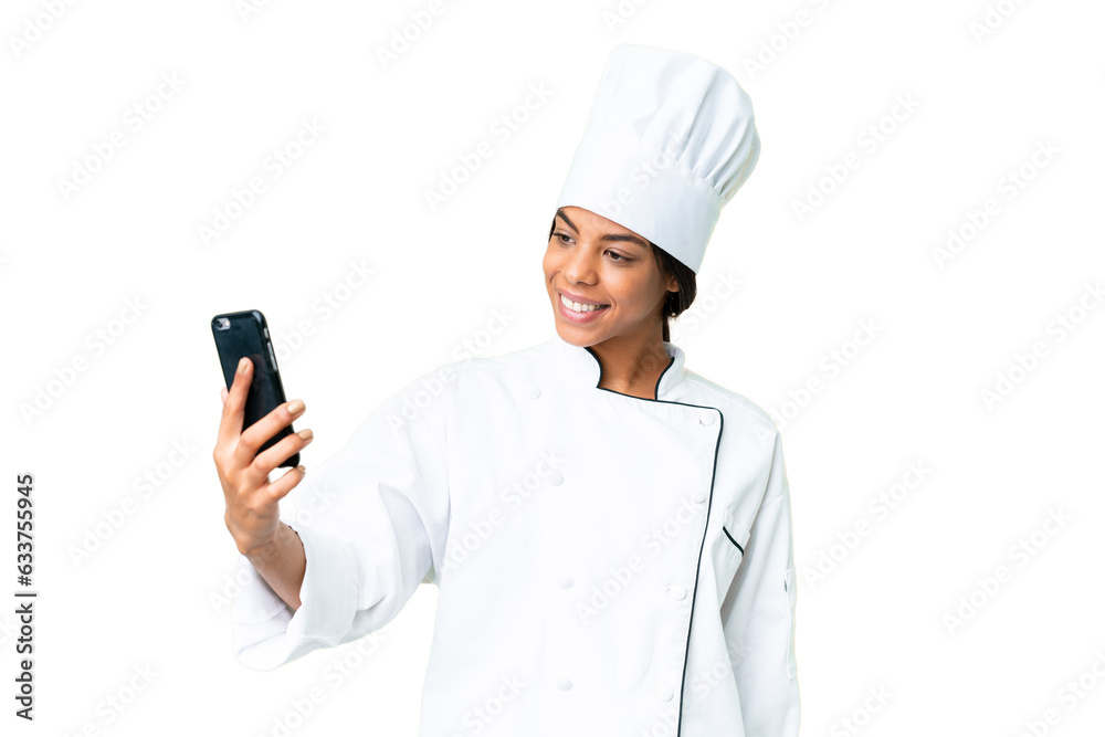 Young African American chef over isolated chroma key background making a selfie Young African American chef over isolated chroma key background making a selfie