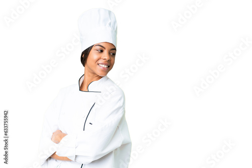 Young African American chef over isolated chroma key background with arms crossed and happy