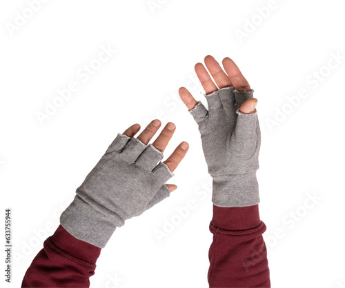 two hands in gray gloves without fingers photo