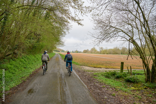 two people riding bicycle in Val de Cher in France in the spring