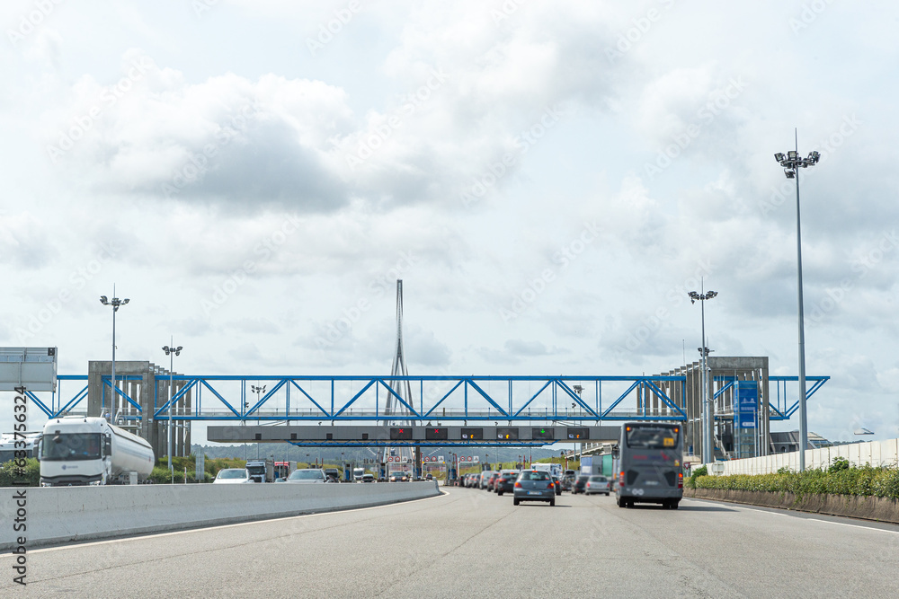 Bridge of Normandy, France - juen-06-223: Cars passing through the toll station Bridge of Normandy, France - juen-06-223: Cars passing through the toll station
